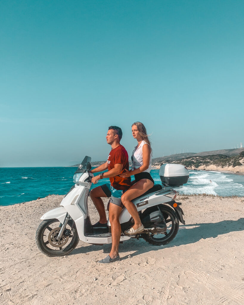 Couple on a scooter at a quiet beach on Kos