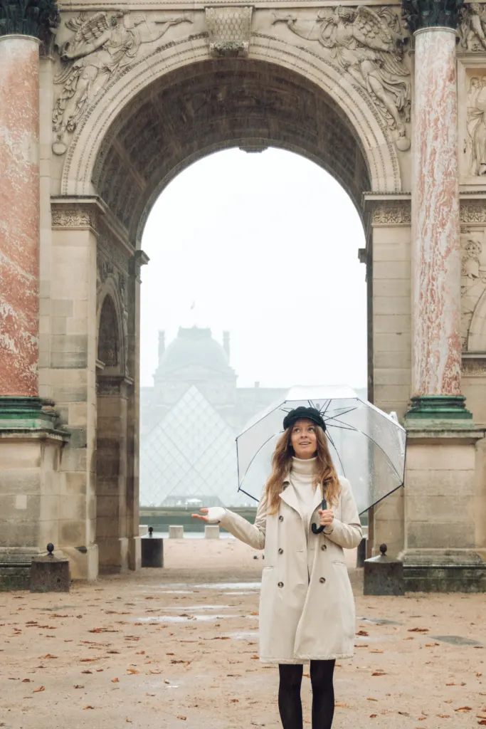 Lore in front of the Louvre arch in Paris