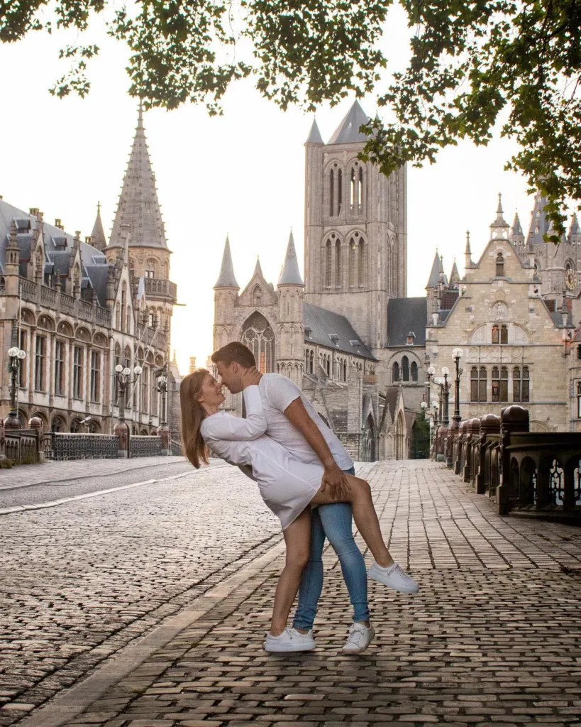 Couple in front of the historic buildings of Ghent
